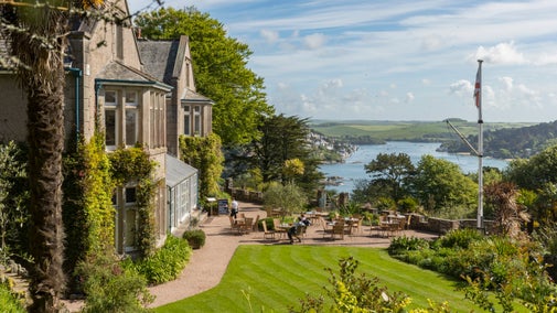 Visitors on the terrace, with views overlooking the Salcombe Estuary at Overbeck's, Devon